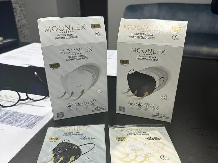 Retail boxes and sample respirators on the specification desk